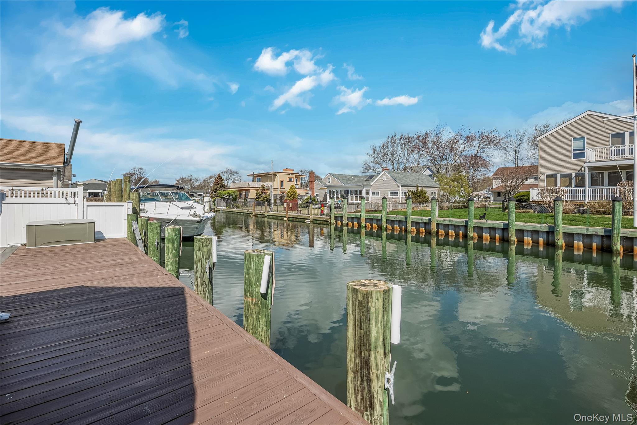 25 Cape Road Amityville, NY 11701 - Photo 3 of 30 a view of a lake with a city
