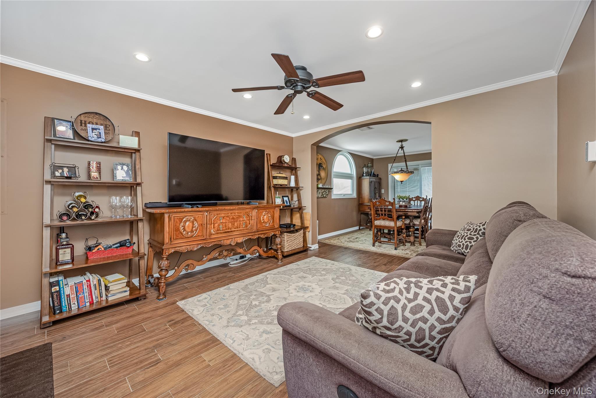 25 Cape Road Amityville, NY 11701 - Photo 5 of 30 a living room with furniture and a flat screen tv