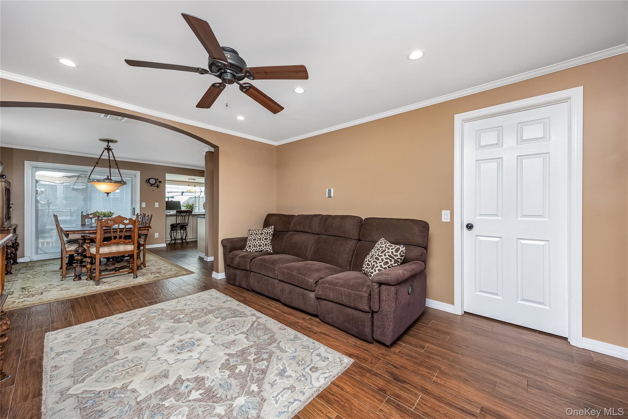 25 Cape Road Amityville, NY 11701 - Photo 6 of 30 a living room with furniture and a wooden floor
