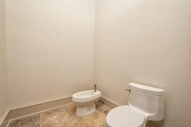 a view of a balcony with floor to ceiling windows with wooden floor