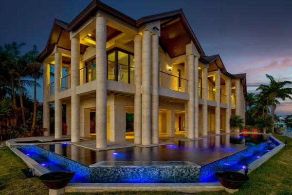 a view of a backyard with potted plants