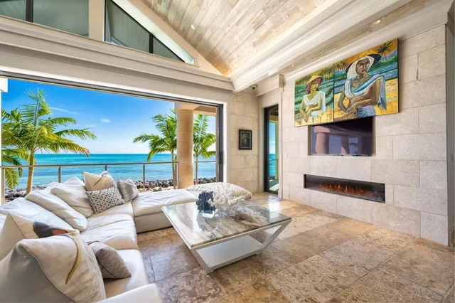 a bedroom with furniture and a large window