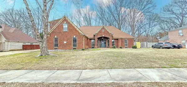 front view of a house with a yard