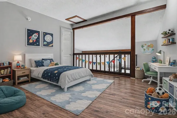 a bedroom with a bed and a table in it