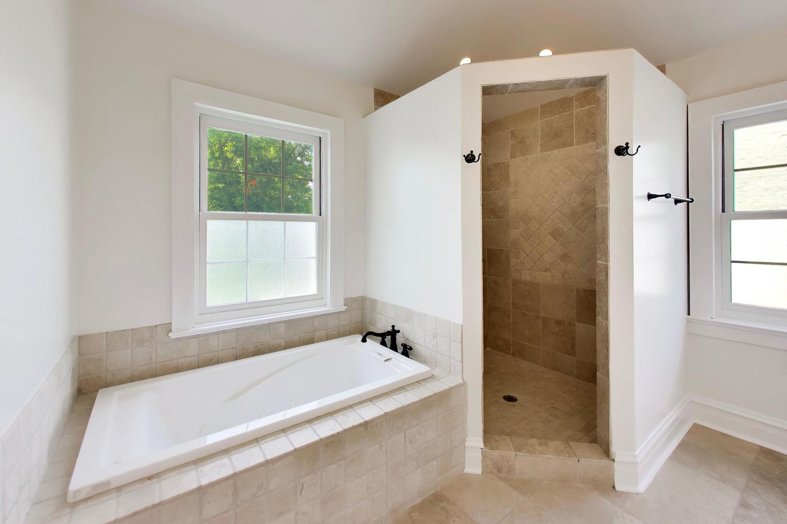 931 Pontiac Road Wilmette, IL 60091 - Photo 10 of 18 a bathroom with a bathtub and shower