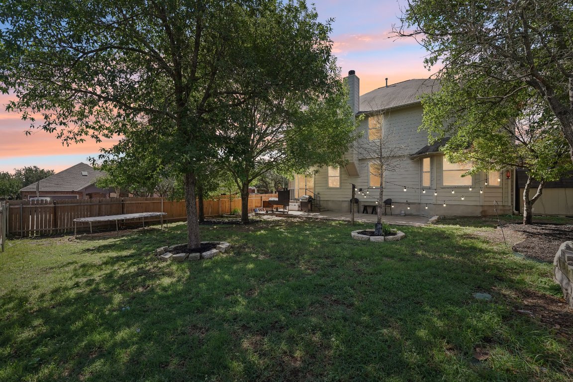 504 Chaparral Drive Leander, TX 78641 - Photo 30 of 34 a view of backyard with tree