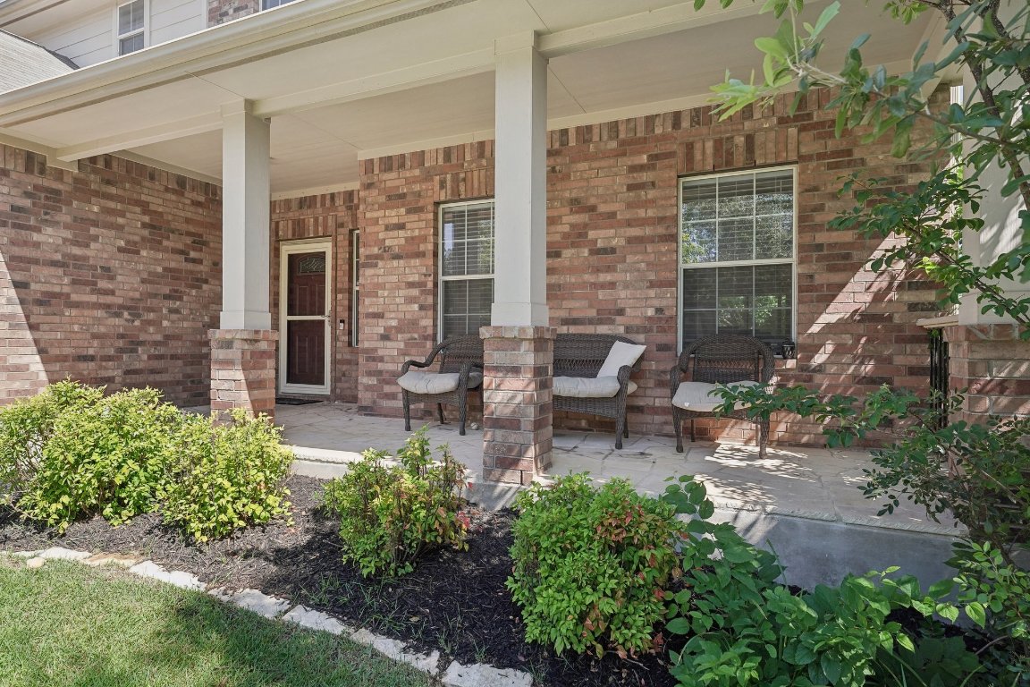 504 Chaparral Drive Leander, TX 78641 - Photo 4 of 34 a view of a patio with table and chairs and potted plants
