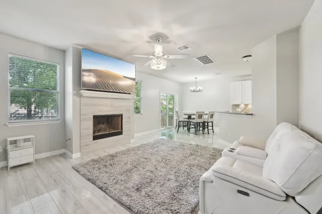 a living room with furniture and a fireplace