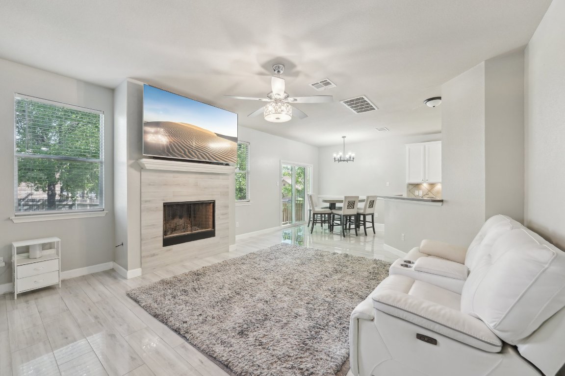 504 Chaparral Drive Leander, TX 78641 - Photo 5 of 34 a living room with furniture and a fireplace