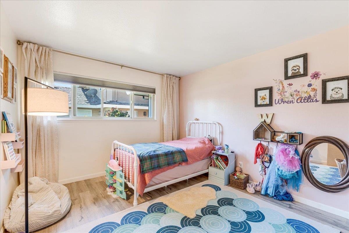 1415 Ruby Court, Unit 1 Capitola, CA 95010 - Photo 11 of 20 a bedroom with a bed and a window