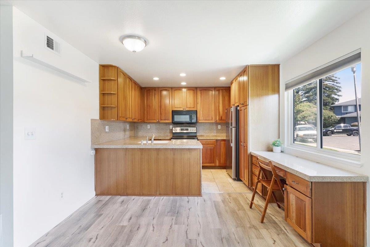 1415 Ruby Court, Unit 1 Capitola, CA 95010 - Photo 3 of 20 a kitchen with stainless steel appliances granite countertop a stove a sink and a refrigerator