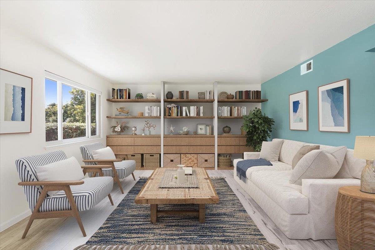 1415 Ruby Court, Unit 1 Capitola, CA 95010 - Photo 4 of 20 a living room with furniture and a book shelf