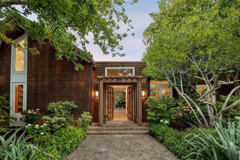 a front view of a house with garden