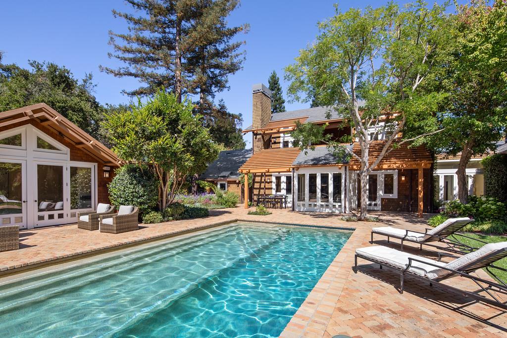 10 Faxon Forest Atherton, CA 94027 - Photo 14 of 16 a front view of a house with a yard table and chairs