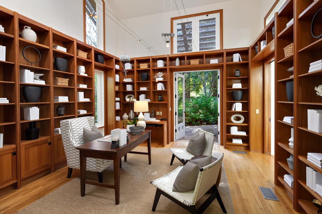10 Faxon Forest Atherton, CA 94027 - Photo 4 of 16 a living room with furniture a bookshelf and a large window