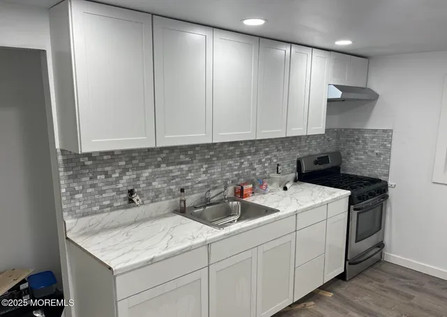 a kitchen with a sink and cabinets