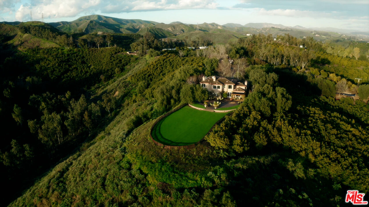 8018 Balcom Canyon Road Somis, CA 93066 - Photo 1 of 36 a view of a garden with an outdoor seating