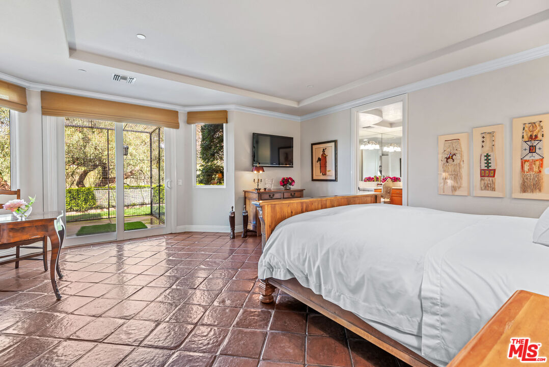 8018 Balcom Canyon Road Somis, CA 93066 - Photo 19 of 36 a bedroom with a bed and large windows