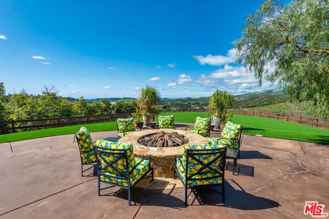 a view of an ocean and a yard