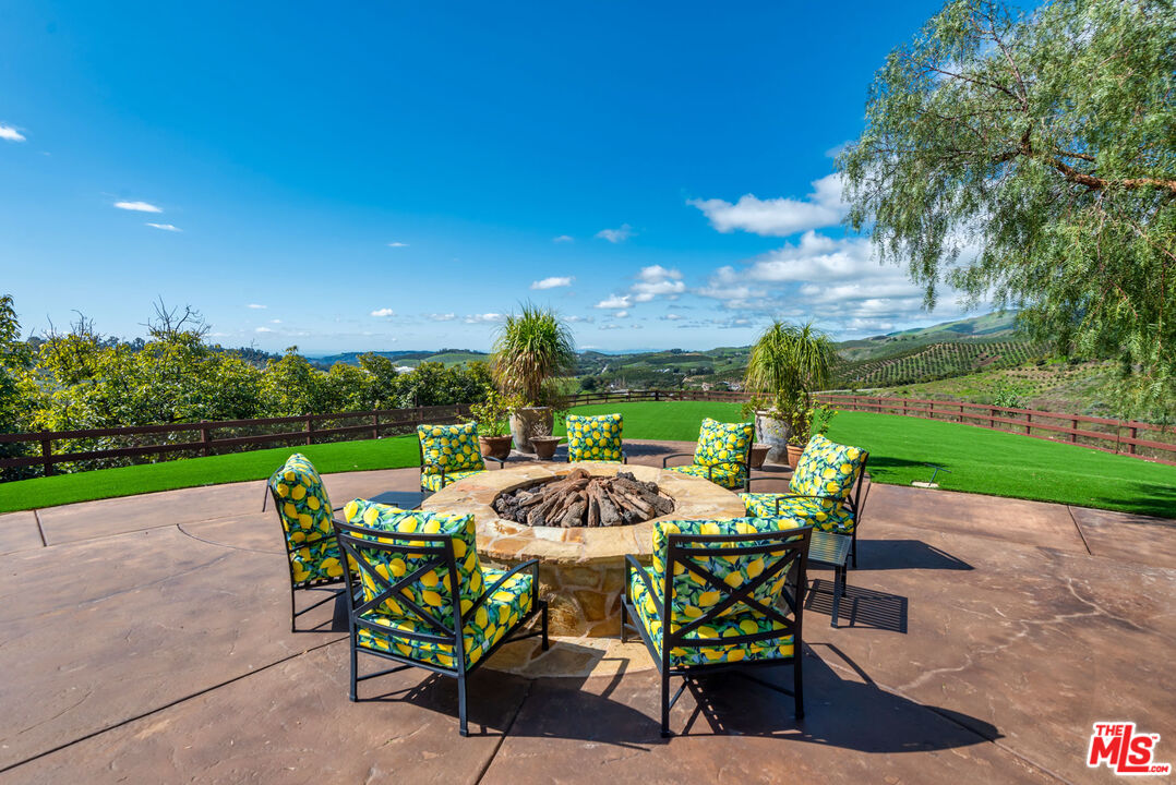 8018 Balcom Canyon Road Somis, CA 93066 - Photo 23 of 36 a view of a chairs and table in the patio