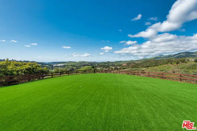 a house with trees in the background