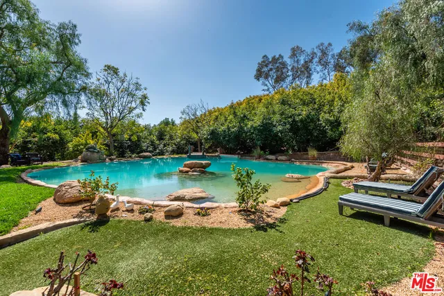 a view of a lake with a yard