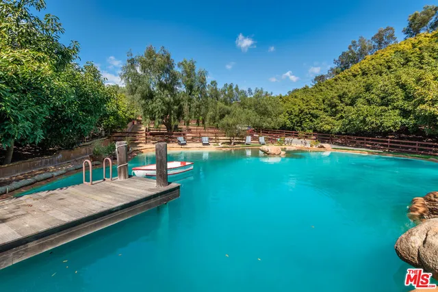 a view of a lake with a swimming pool