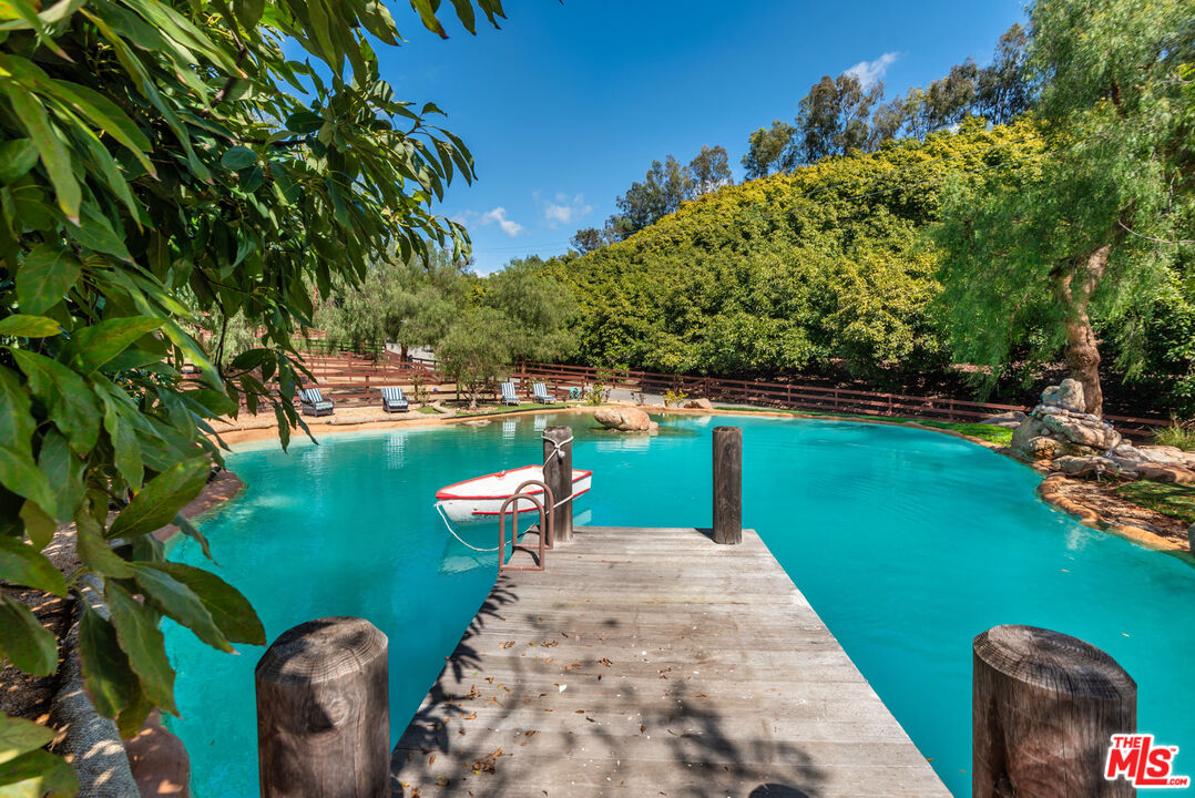 8018 Balcom Canyon Road Somis, CA 93066 - Photo 9 of 36 a view of a lake with a swimming pool