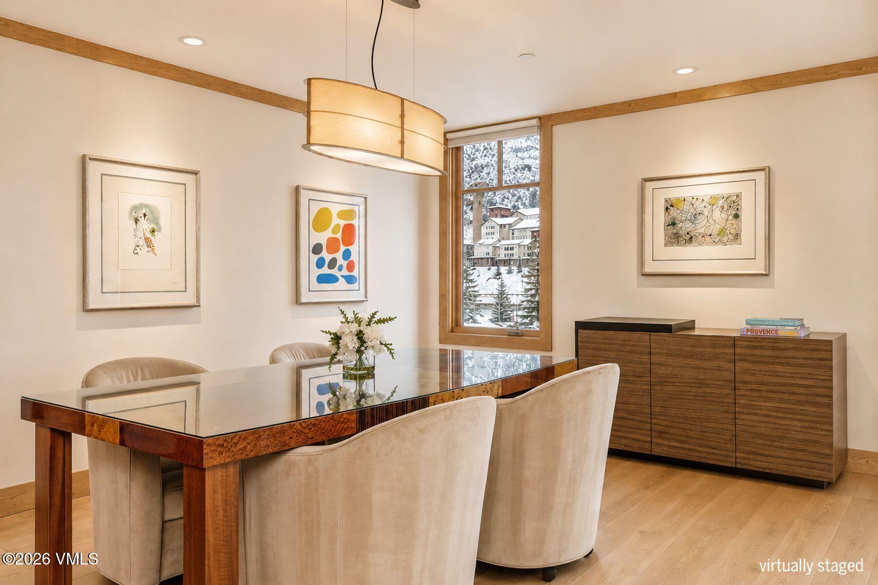 1 Vail Road, Unit 9204 Vail, CO 81657 - Photo 11 of 27 a dining room with furniture and window