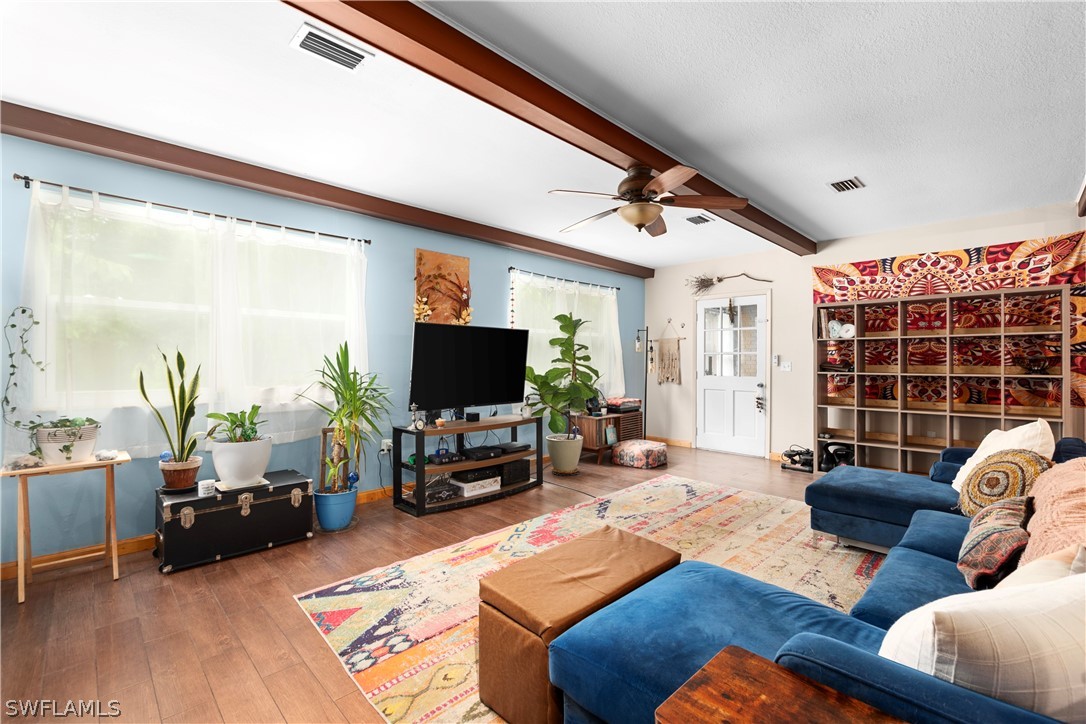 1745 County Road 731 Venus, FL 33960 - Photo 17 of 45 a living room with furniture and a flat screen tv