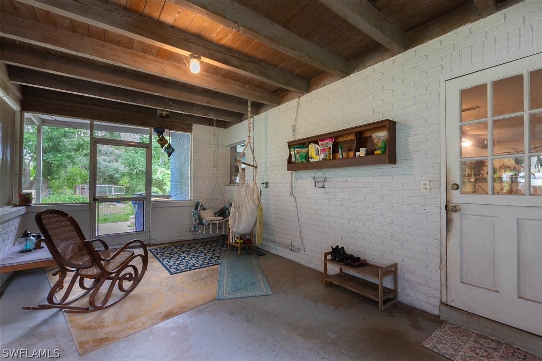 1745 County Road 731 Venus, FL 33960 - Photo 29 of 45 a living room with furniture a window and a flat screen tv