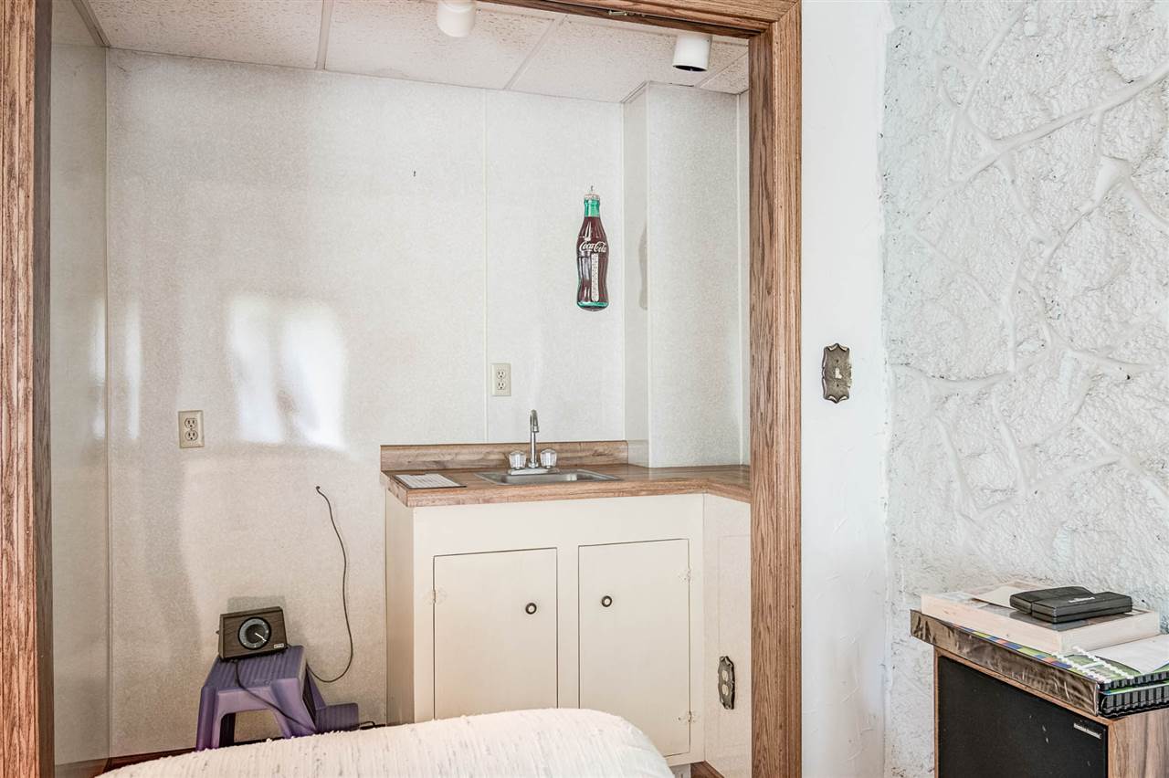 1962 Baintree Road Lake Summerset, IL 61019 - Photo 20 of 25 a bathroom with a granite countertop sink a toilet a mirror and shower