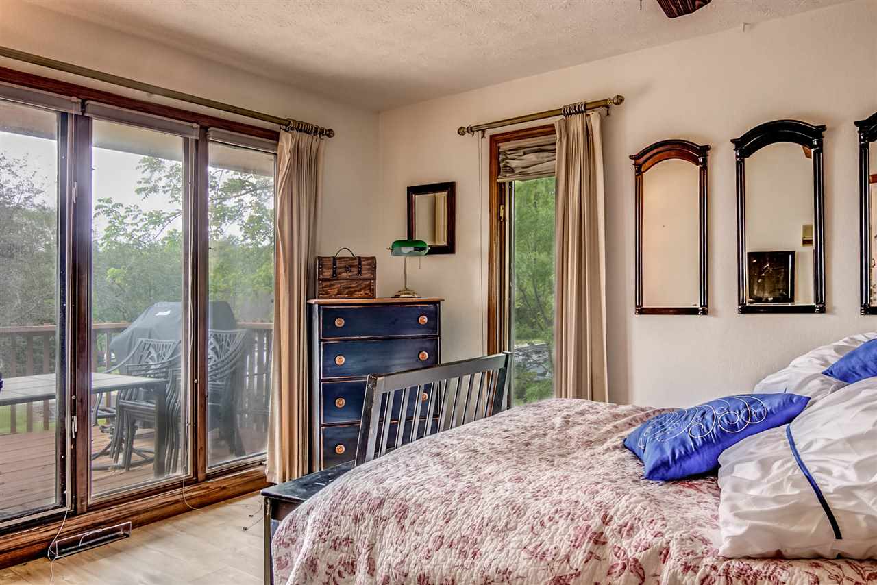 1962 Baintree Road Lake Summerset, IL 61019 - Photo 9 of 25 a bedroom with a large bed and a balcony view