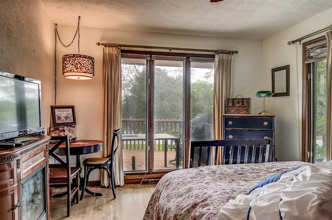 1962 Baintree Road Lake Summerset, IL 61019 - Photo 10 of 25 a view of a bedroom with workspace and windows