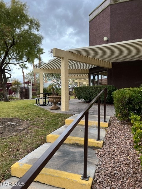 7885 West Flamingo Road, Unit 1064 Las Vegas, NV 89147 - Photo 2 of 19 View of property's community featuring a pergola and a yard