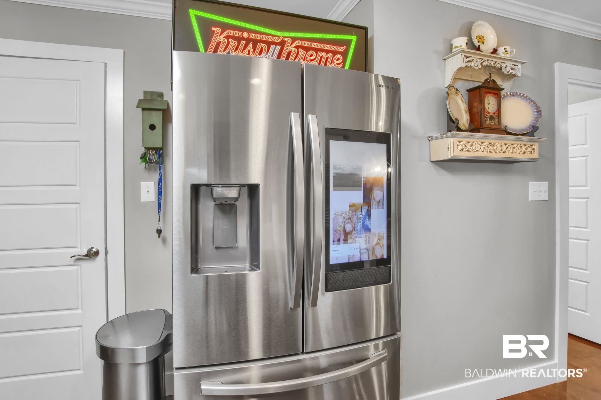 203 Lakefront Circle Summerdale, AL 36580 - Photo 27 of 69 Kitchen featuring stainless steel refrigerator with ice dispenser, crown molding, and hardwood / wood-style floors