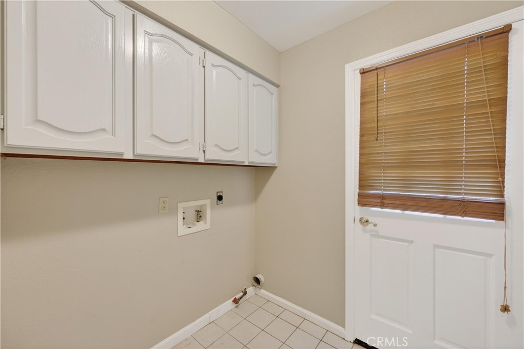 19540 Chinotto Lane Riverside, CA 92508 - Photo 25 of 69 Separate laundry room with plenty of storage