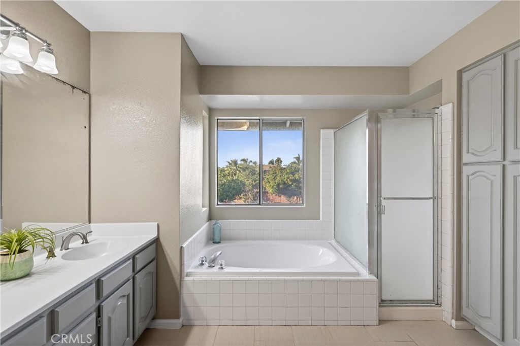 19540 Chinotto Lane Riverside, CA 92508 - Photo 49 of 69 Primary bath with separate tub and shower
