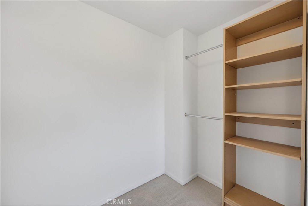 19540 Chinotto Lane Riverside, CA 92508 - Photo 50 of 69 Open walk-in closet with built-in shelving