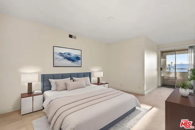 a bedroom with a bed and glass wall painting