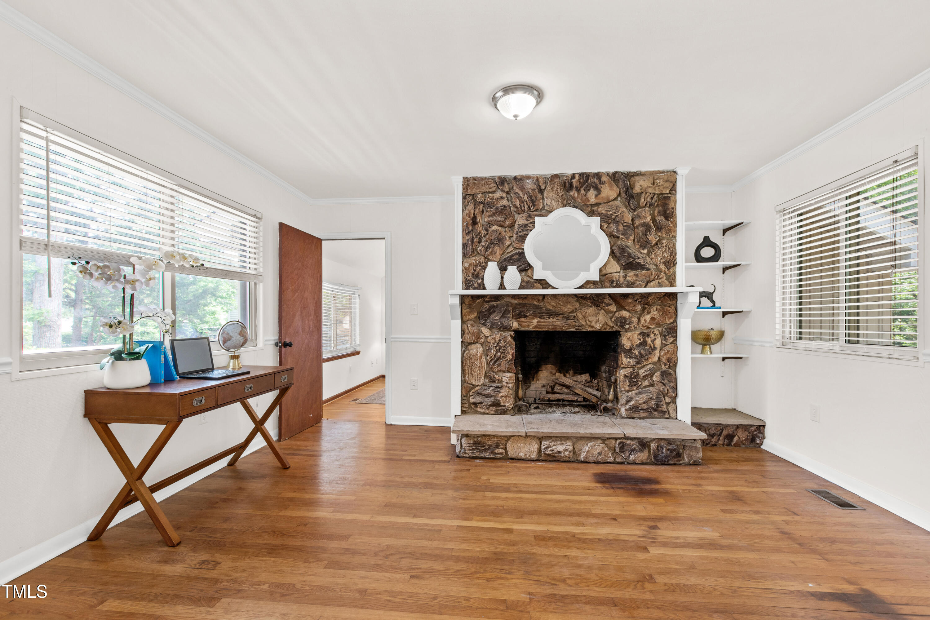 1915 Redding Lane Durham, NC 27712 - Photo 11 of 45 a living room with furniture and a fireplace