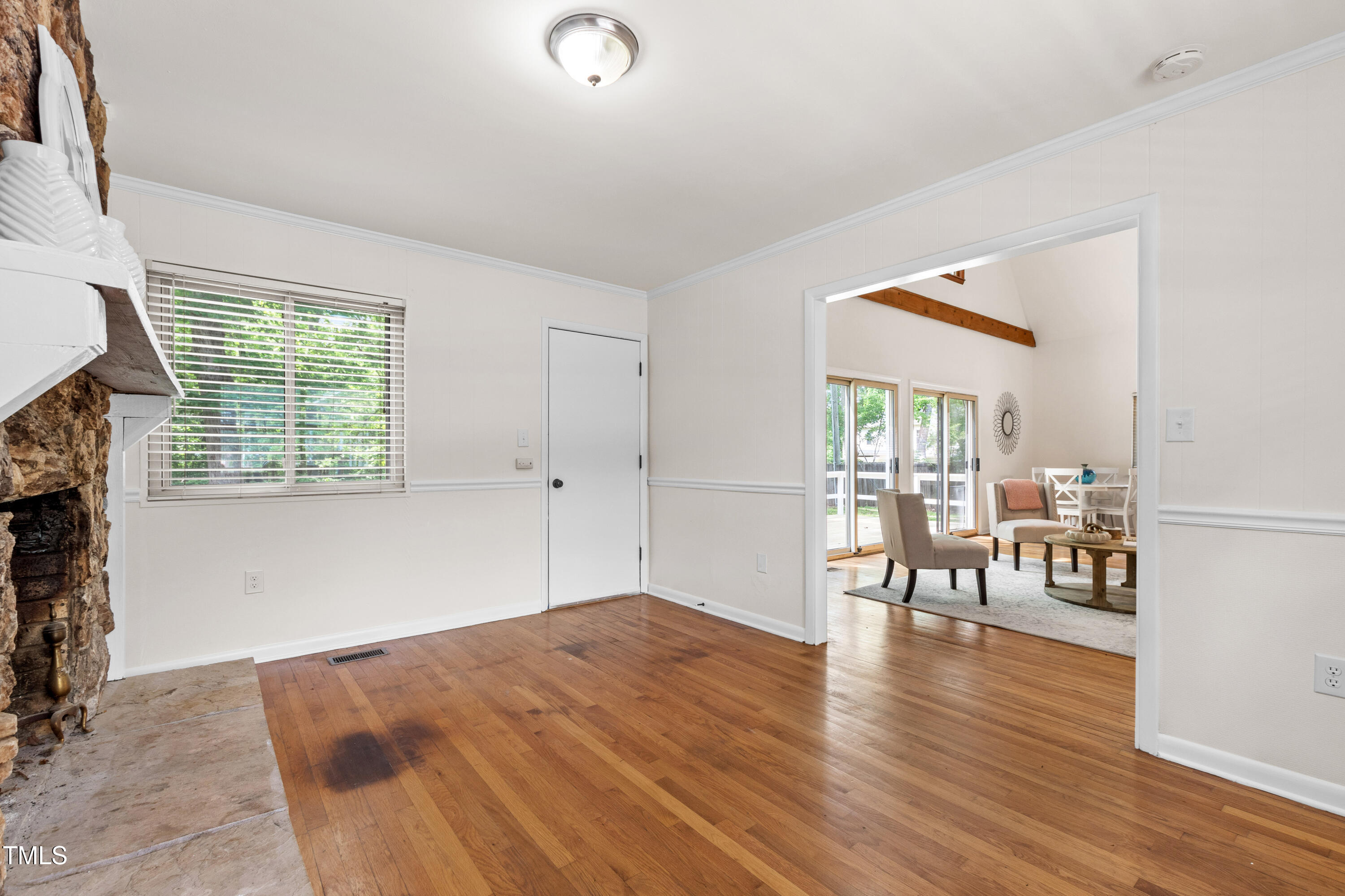 1915 Redding Lane Durham, NC 27712 - Photo 12 of 45 wooden floor in an empty room with a window