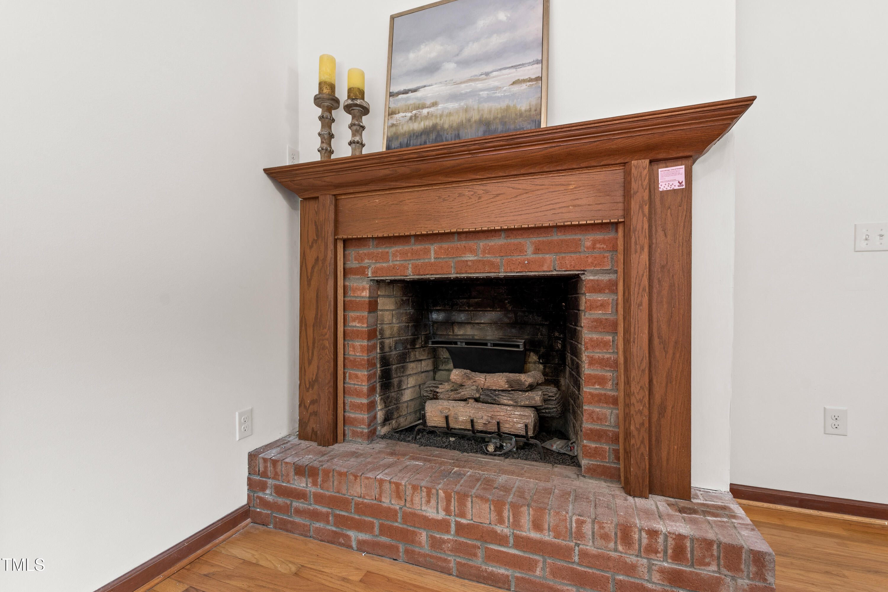 1915 Redding Lane Durham, NC 27712 - Photo 15 of 45 a living room with furniture and a fireplace