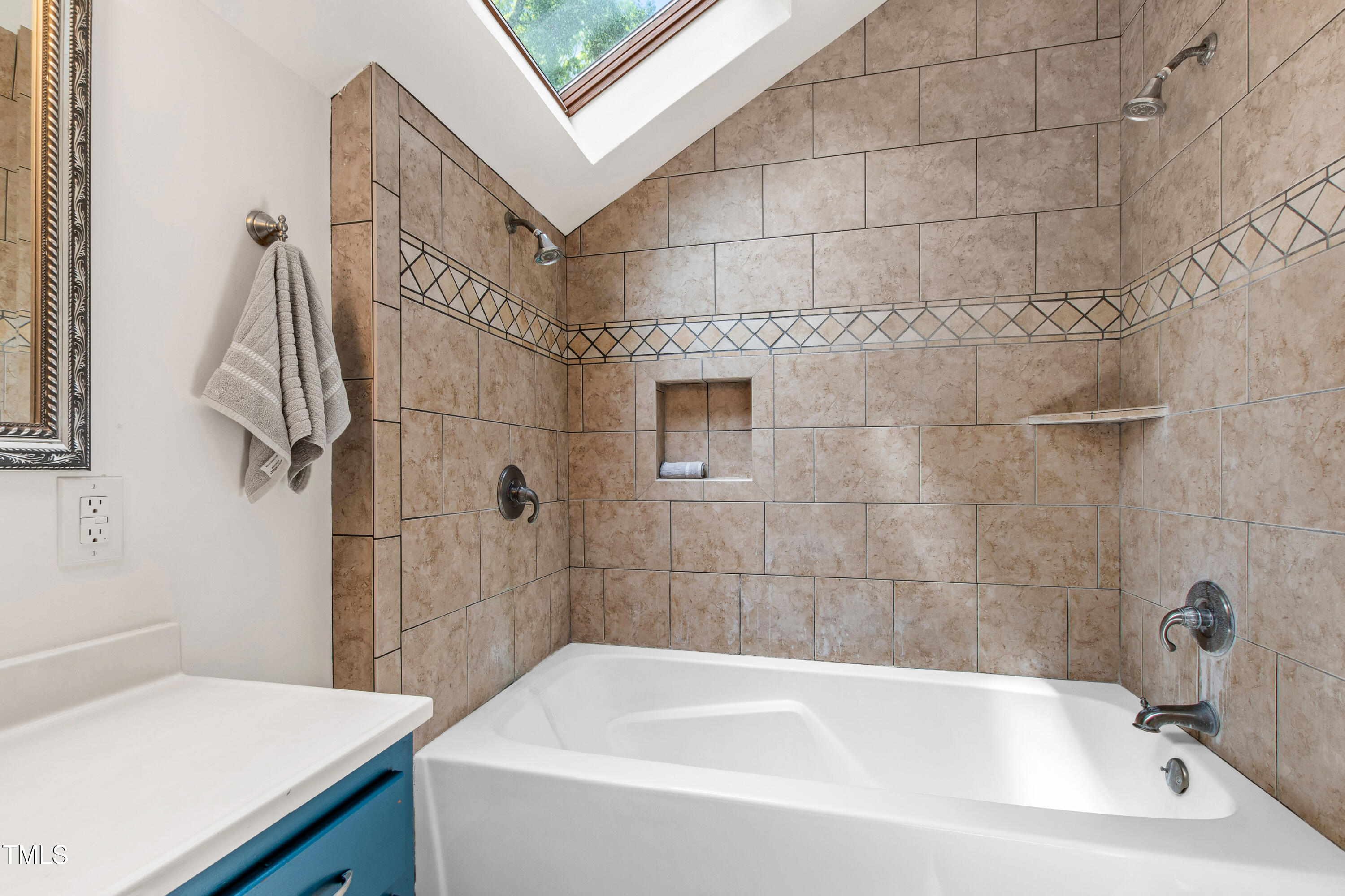 1915 Redding Lane Durham, NC 27712 - Photo 19 of 45 a bathroom with a sink and a bathtub