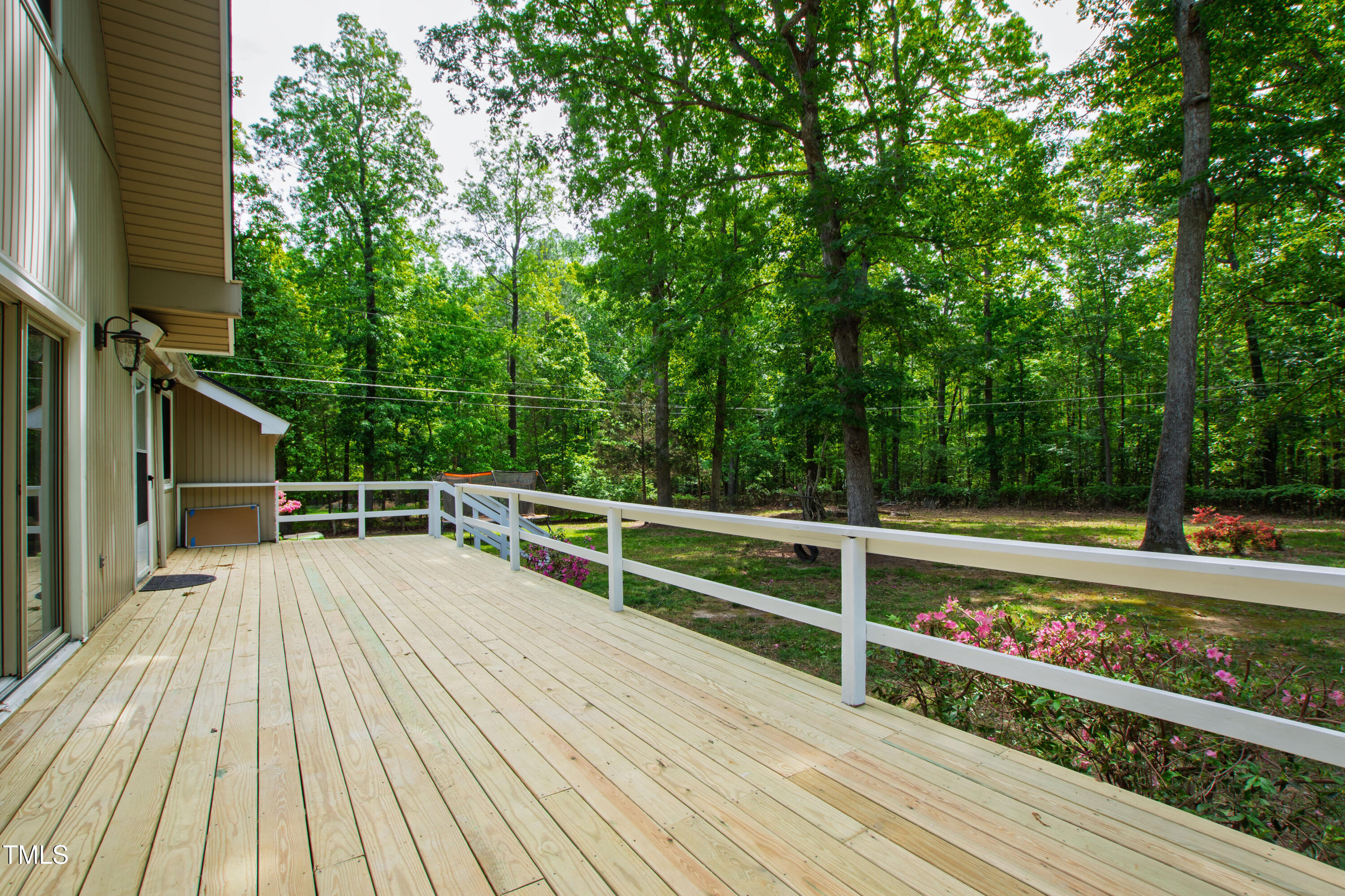 1915 Redding Lane Durham, NC 27712 - Photo 21 of 45 a view of deck with seating and trees
