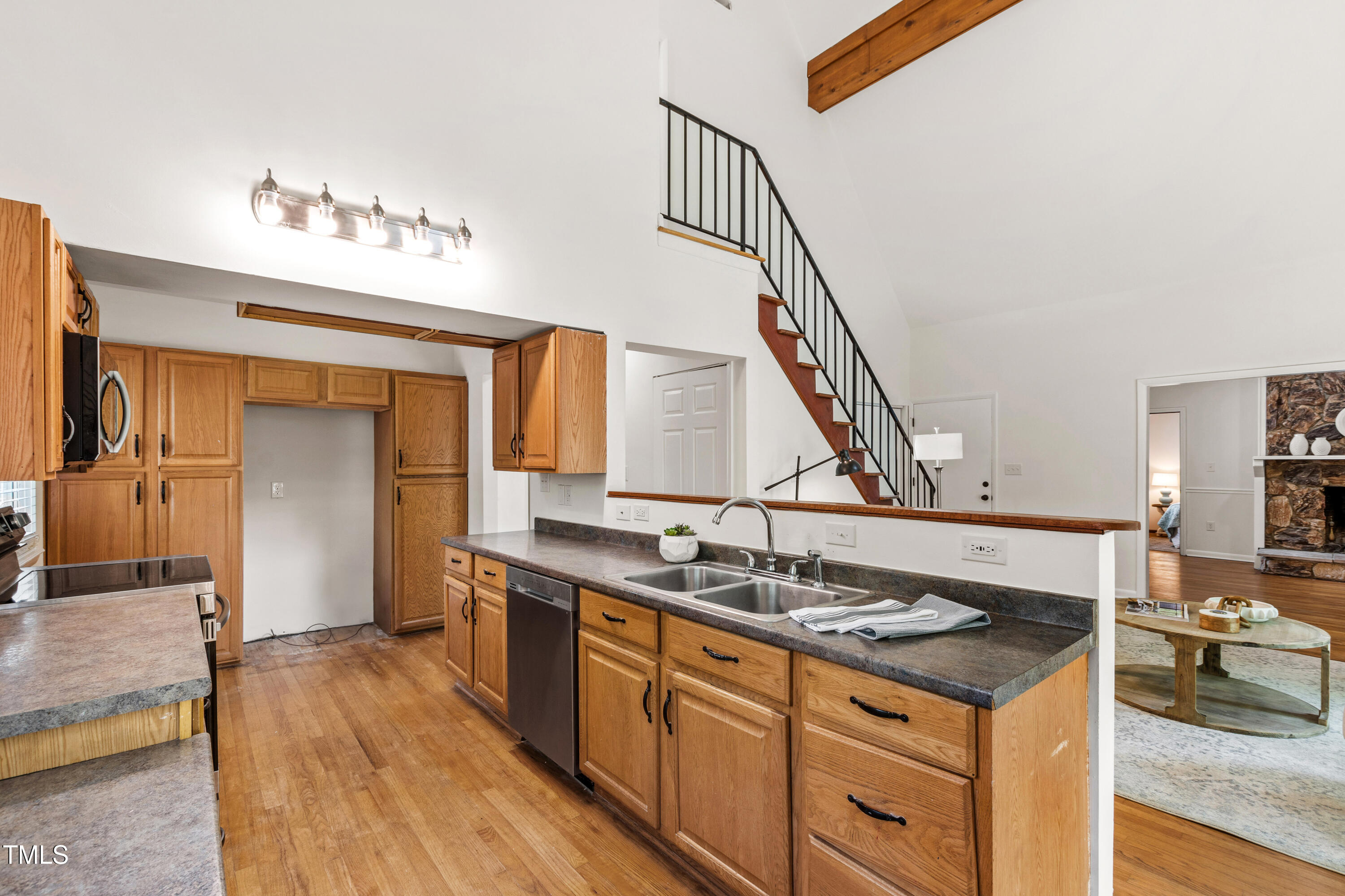 1915 Redding Lane Durham, NC 27712 - Photo 24 of 45 a kitchen with a sink and a stove top oven