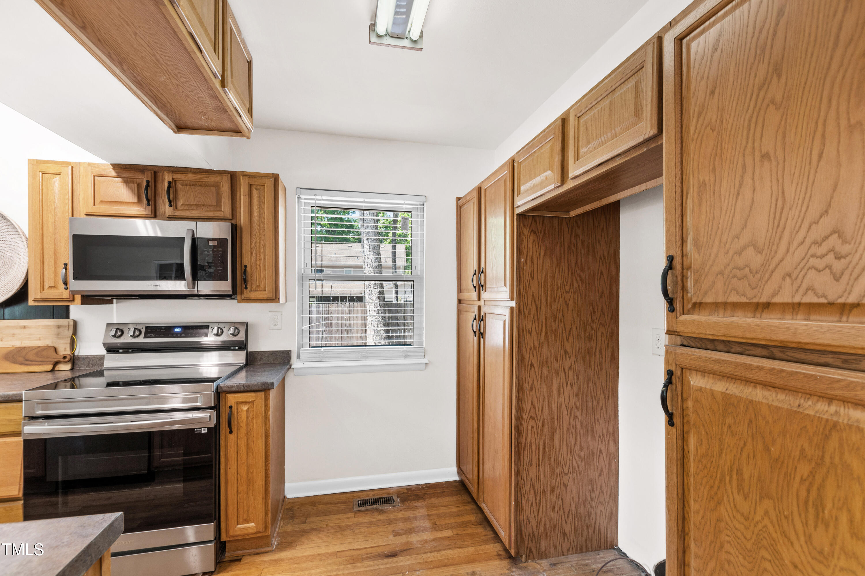 1915 Redding Lane Durham, NC 27712 - Photo 27 of 45 a kitchen with stainless steel appliances a stove and a microwave