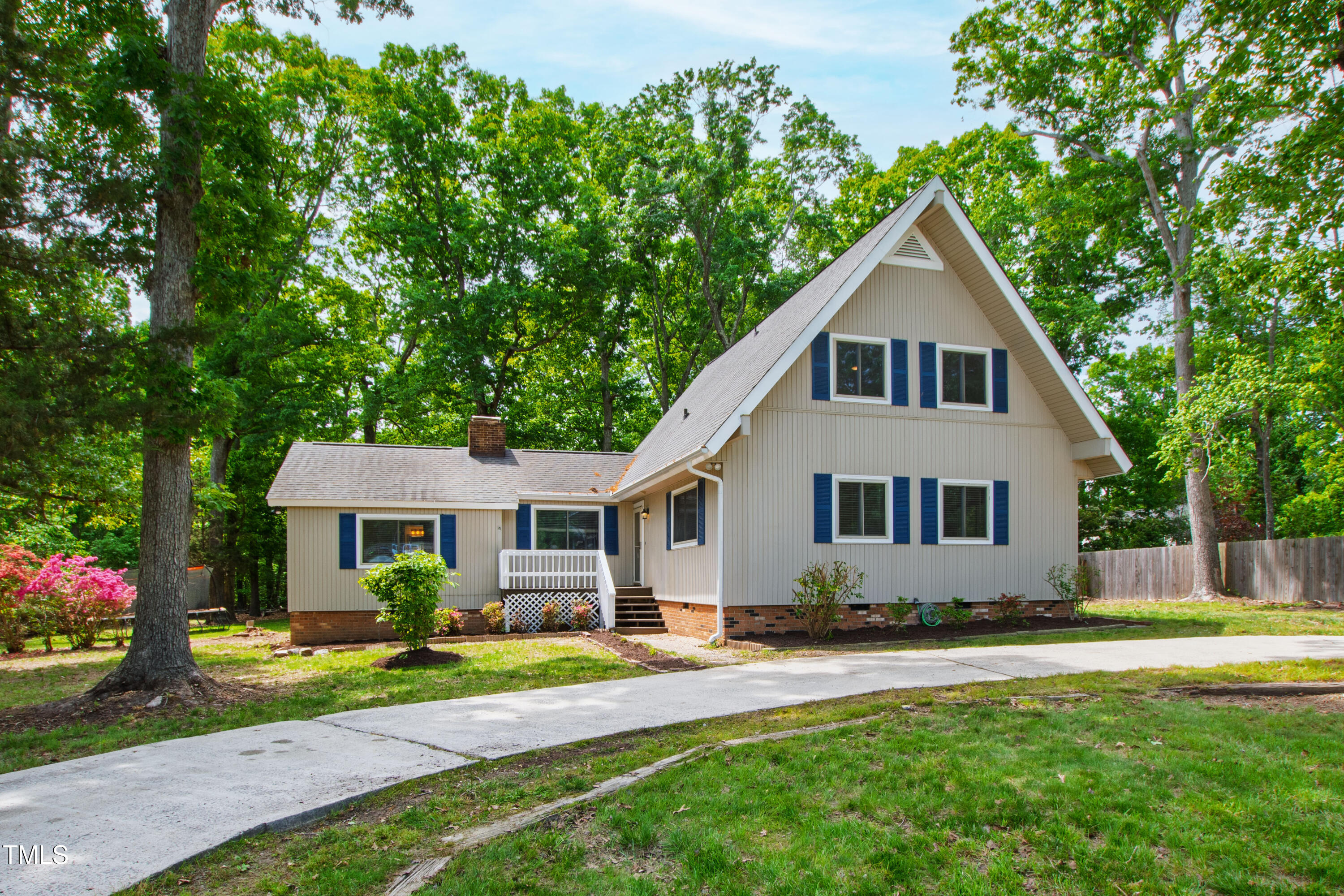 1915 Redding Lane Durham, NC 27712 - Photo 3 of 45 a front view of a house with a yard