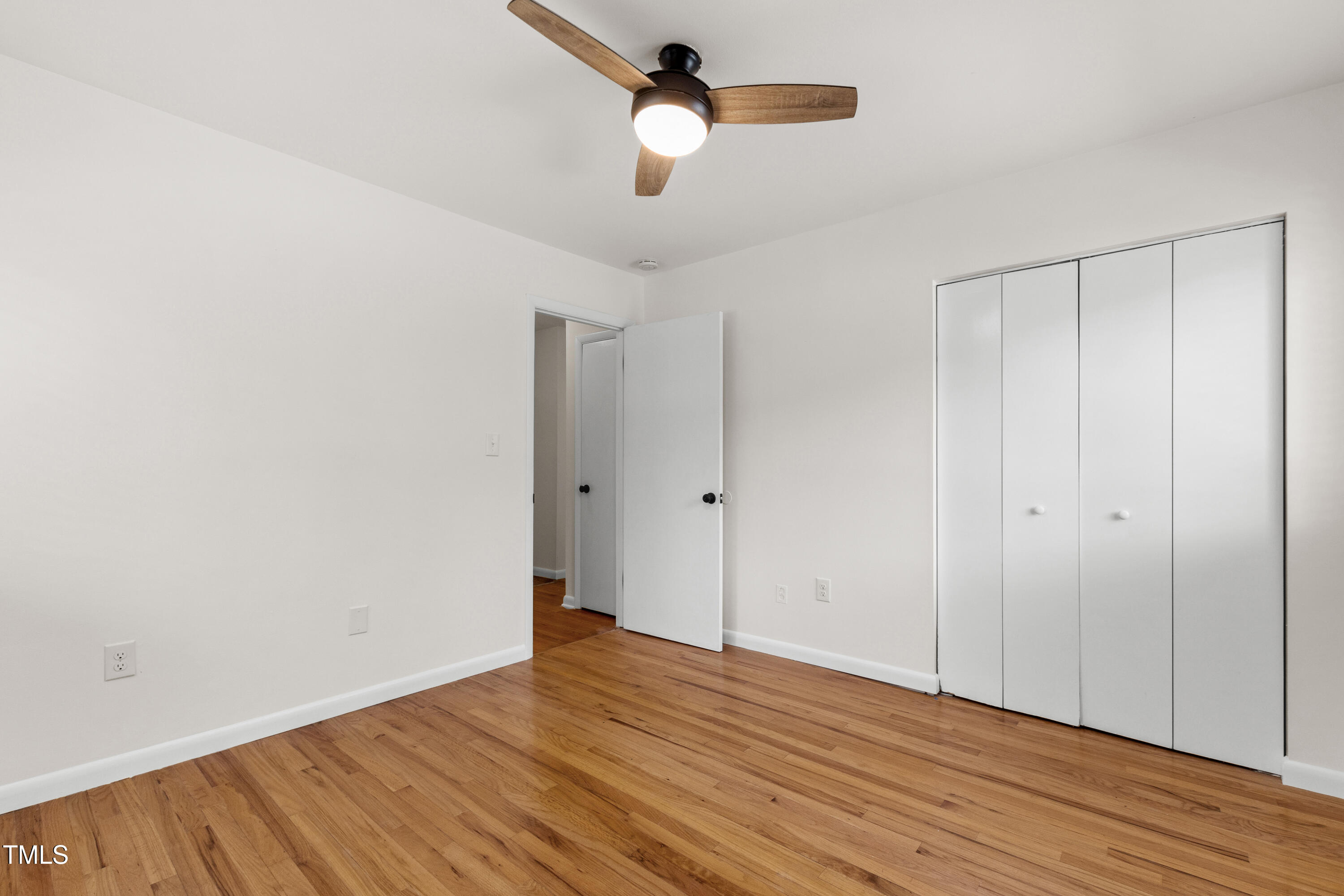 1915 Redding Lane Durham, NC 27712 - Photo 33 of 45 a view of empty room with wooden floor