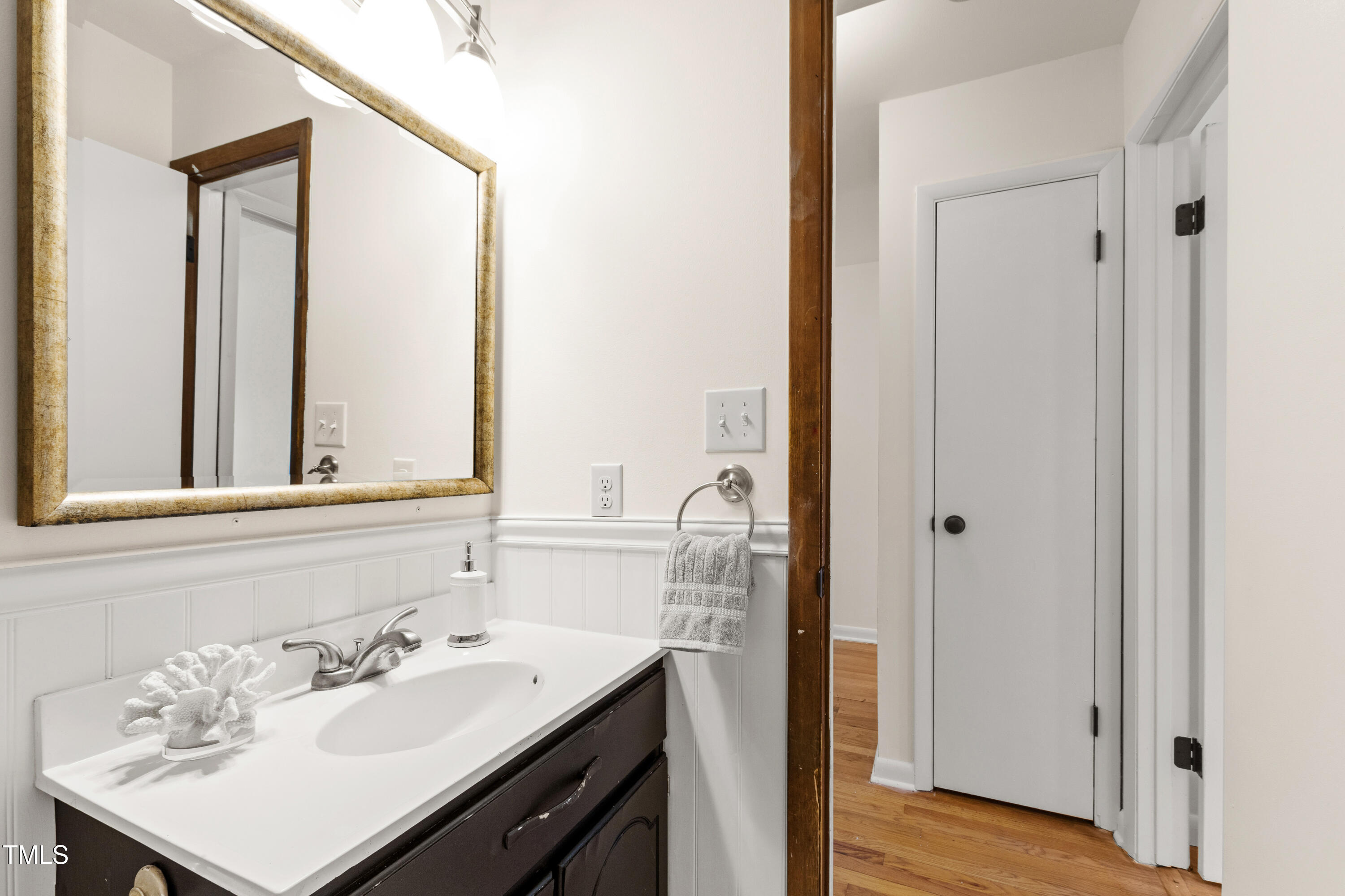 1915 Redding Lane Durham, NC 27712 - Photo 35 of 45 a bathroom with a sink vanity and a mirror